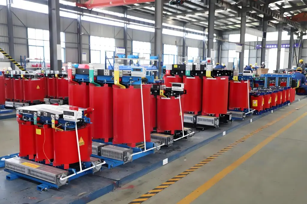 Dry Type Transformer Cast resin dry type transformer assemblies arranged on a production floor