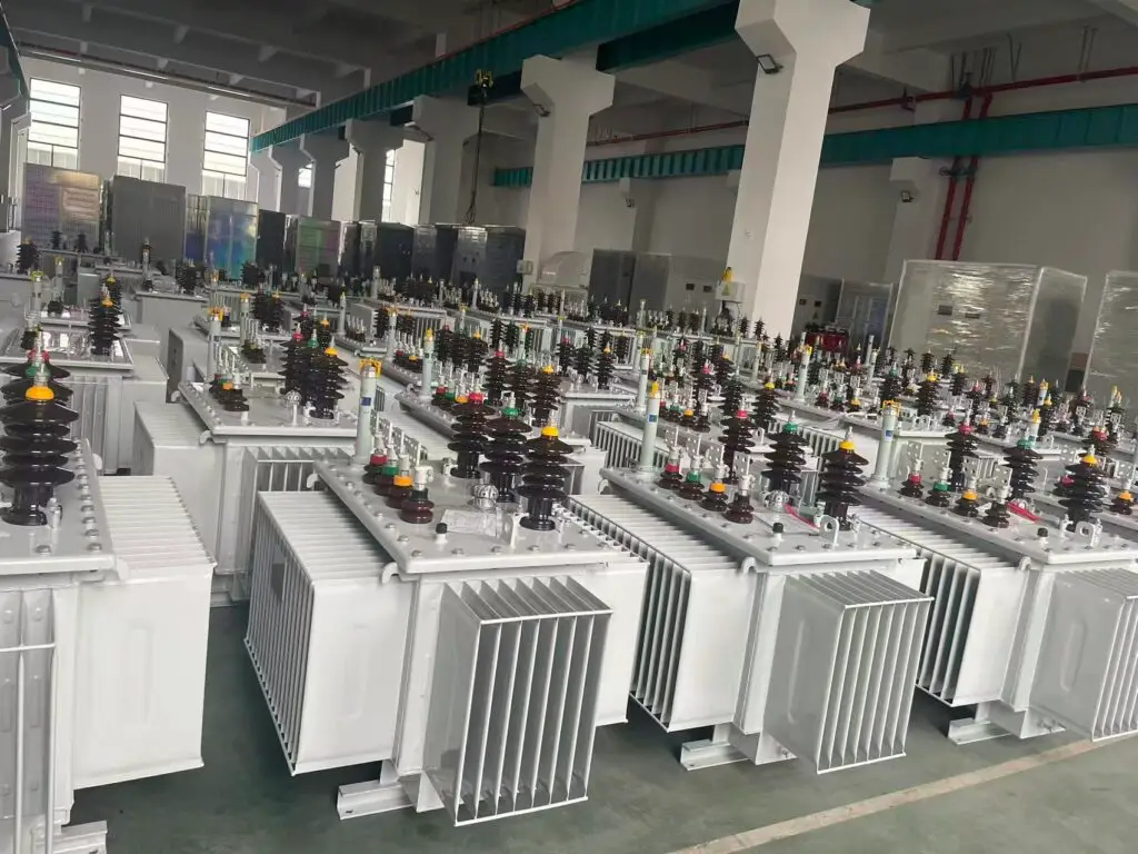 Distribution Transformer Rows of oil-immersed distribution transformers in a manufacturing workshop